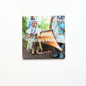 Lovevery - Kids Montessori Board Book - Adela Comes Home